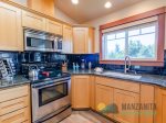The kitchen has stainless steel appliances and everything needed to cook meals for the entire group.